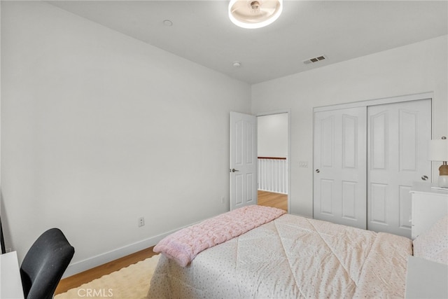 28321 Esplanada Dr, Valencia, CA 91354 - bedroom featuring wood finished floors, a closet, and baseboards
