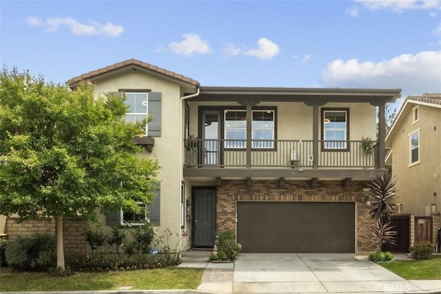 28321 Esplanada Dr, Valencia, CA 91354 - view of front facade featuring stucco siding, a balcony, brick siding, and an attached garage