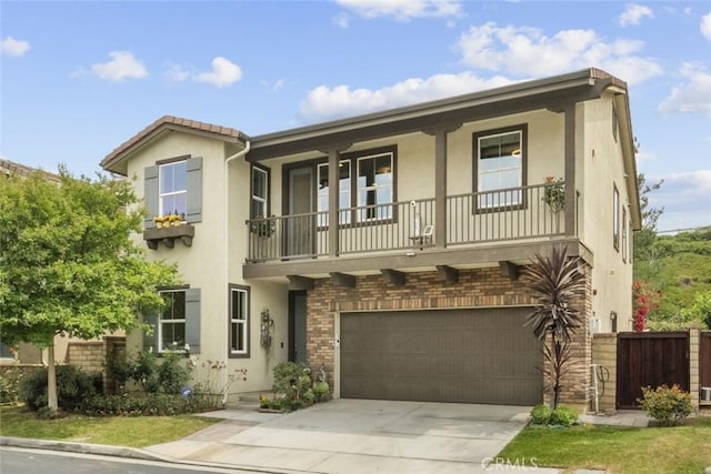 28321 Esplanada Dr, Valencia, CA 91354 - view of front of property featuring stucco siding, a garage, concrete driveway, and a balcony