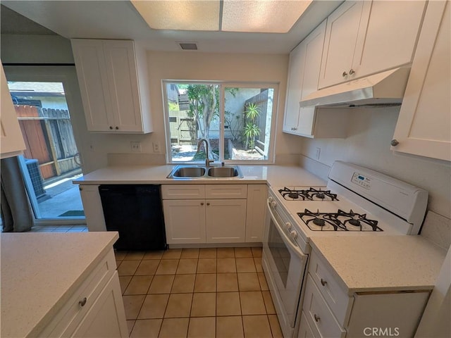 1266 Tarryglen Ln, San Dimas, CA 91773 - kitchen with white gas range oven, black dishwasher, under cabinet range hood, a sink, and light tile patterned floors