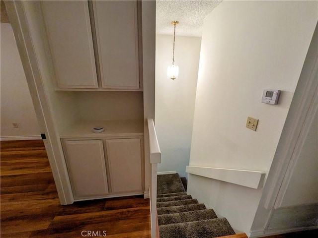 1266 Tarryglen Ln, San Dimas, CA 91773 - stairway with wood finished floors and a textured ceiling
