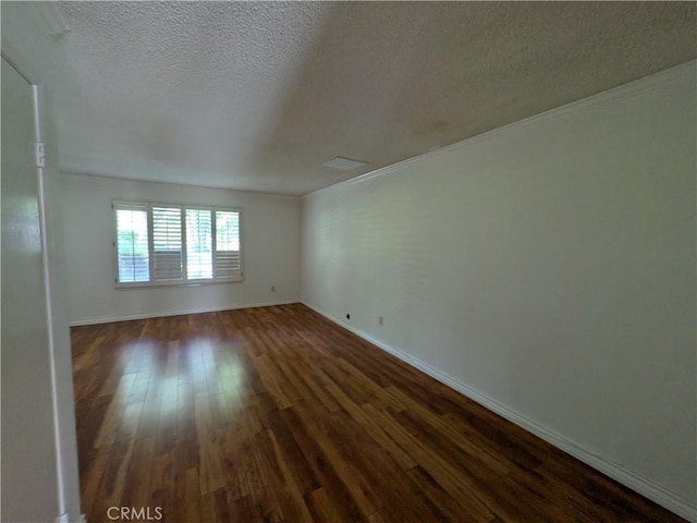 1266 Tarryglen Ln, San Dimas, CA 91773 - empty room with dark wood-style flooring, a textured ceiling, and baseboards