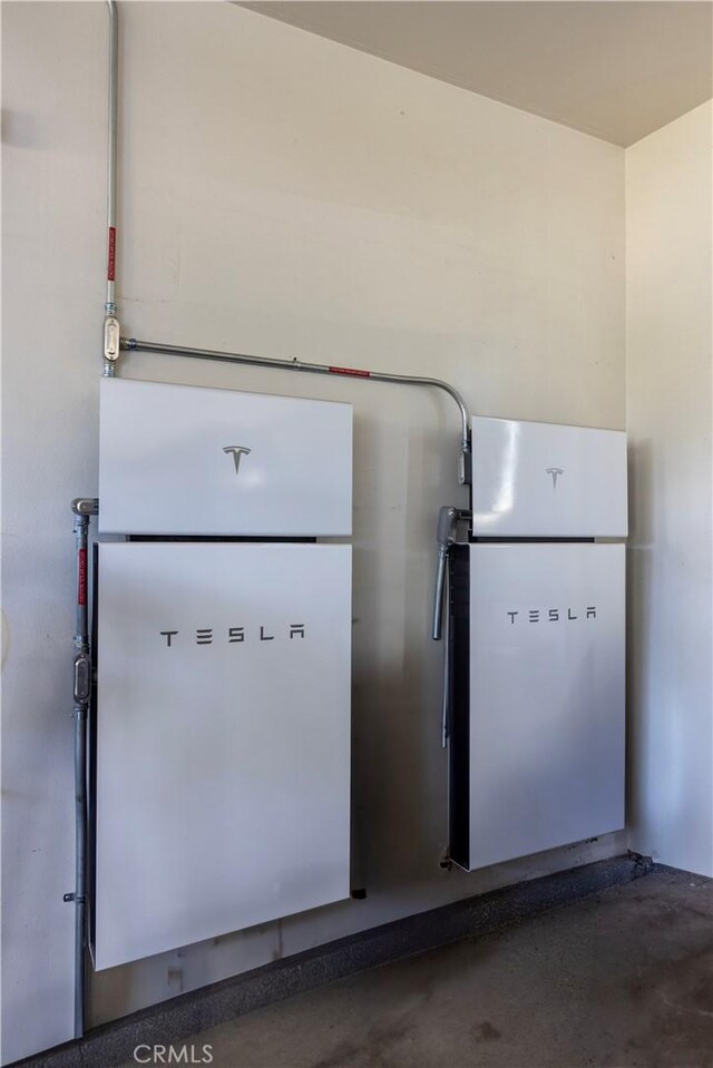 12920 Evermay Ct, Rancho Cucamonga, CA 91739 - kitchen view of wall-mounted power storage and concrete flooring