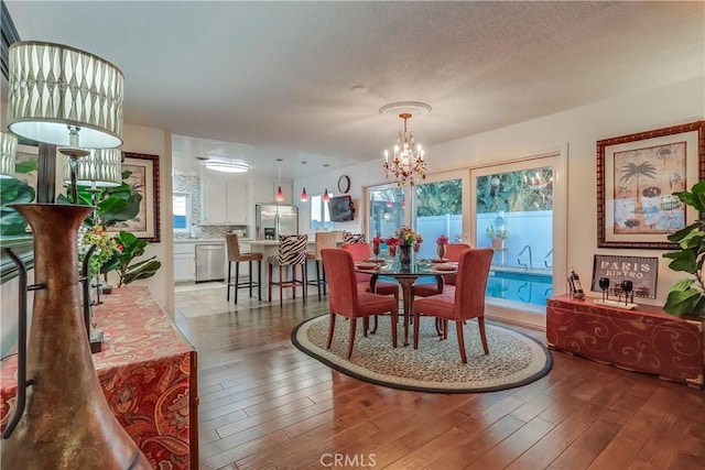 1717 Cumbre Dr, San Pedro, CA 90732 - dining room featuring a chandelier and light wood finished floors