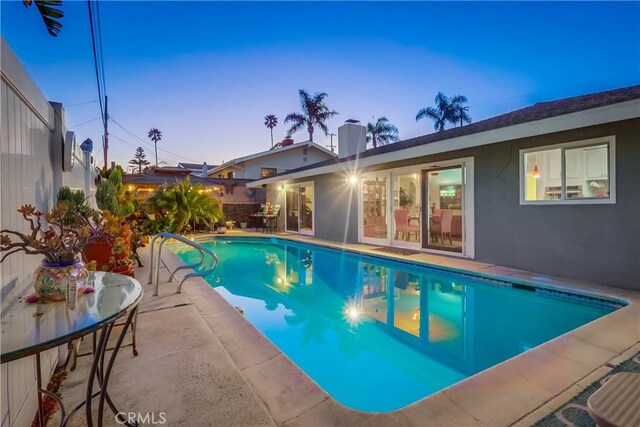 1717 Cumbre Dr, San Pedro, CA 90732 - pool at dusk featuring a patio area