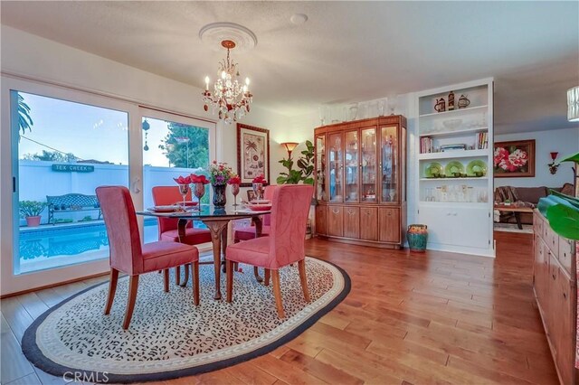 1717 Cumbre Dr, San Pedro, CA 90732 - dining area with a chandelier and light wood-style floors