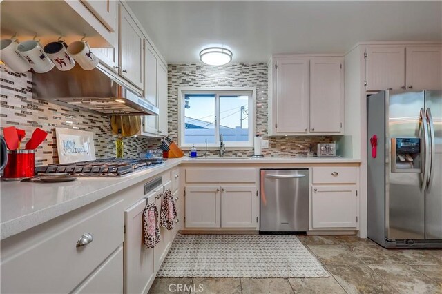 1717 Cumbre Dr, San Pedro, CA 90732 - kitchen with stainless steel appliances, a sink, light countertops, and backsplash