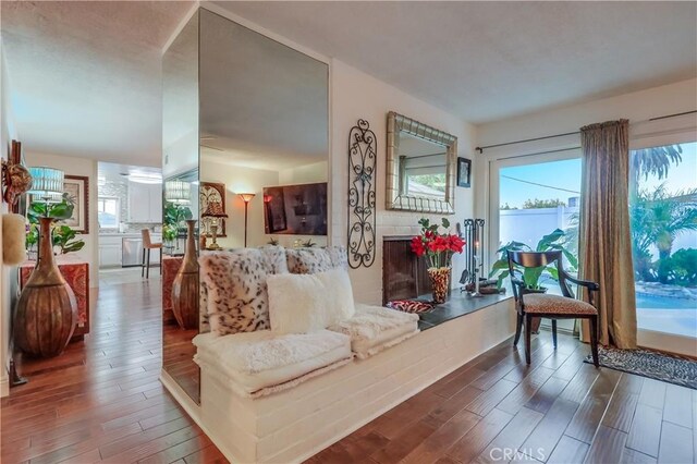 1717 Cumbre Dr, San Pedro, CA 90732 - living area with wood finished floors and a fireplace with raised hearth