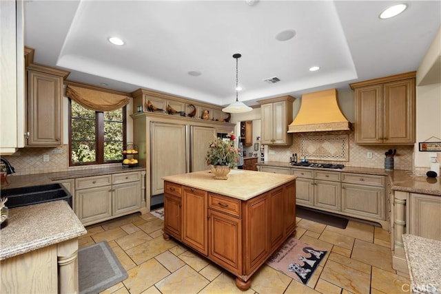 4204 Woodleigh Ln, La Canada Flintridge, CA 91011 - kitchen with premium range hood, a tray ceiling, a sink, recessed lighting, and decorative backsplash