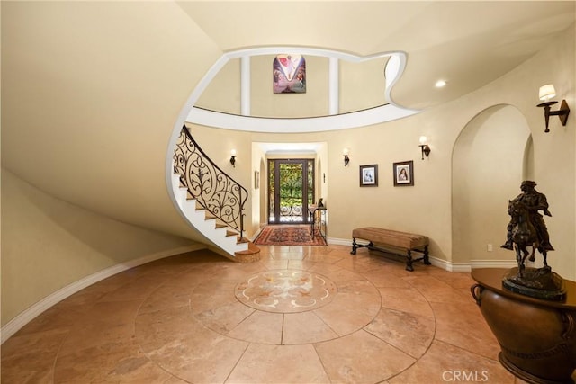 4204 Woodleigh Ln, La Canada Flintridge, CA 91011 - foyer with stairway, tile patterned flooring, baseboards, and inlaid floor details