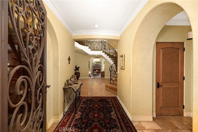 4204 Woodleigh Ln, La Canada Flintridge, CA 91011 - entryway featuring arched walkways, ornamental molding, stairway, recessed lighting, and baseboards