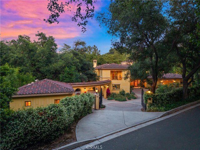 4204 Woodleigh Ln, La Canada Flintridge, CA 91011 - mediterranean / spanish home with stucco siding, a tiled roof, and a chimney