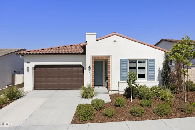 508 Autumn Path Ln, Santa Paula, CA 93060 - mediterranean / spanish-style house with an attached garage, stucco siding, driveway, and a tile roof