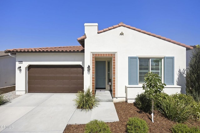 508 Autumn Path Ln, Santa Paula, CA 93060 - mediterranean / spanish-style home featuring an attached garage, stucco siding, concrete driveway, and a tile roof