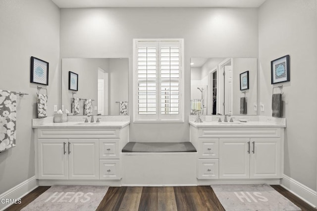 508 Autumn Path Ln, Santa Paula, CA 93060 - bathroom featuring wood finished floors, two vanities, and baseboards