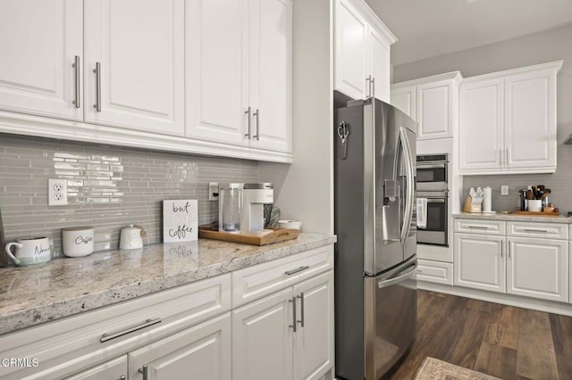 508 Autumn Path Ln, Santa Paula, CA 93060 - kitchen featuring stainless steel appliances, tasteful backsplash, white cabinets, and dark wood-style floors