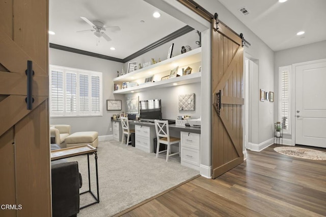 508 Autumn Path Ln, Santa Paula, CA 93060 - office with a barn door, built in desk, baseboards, wood finished floors, and ceiling fan