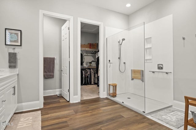 508 Autumn Path Ln, Santa Paula, CA 93060 - full bathroom featuring walk in shower, wood finished floors, vanity, a walk in closet, and recessed lighting