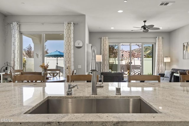 508 Autumn Path Ln, Santa Paula, CA 93060 - kitchen with a sink, open floor plan, light stone countertops, a ceiling fan, and recessed lighting