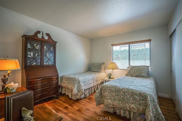 960 Via Serana, Upland, CA 91784 - bedroom featuring wood finished floors and a textured ceiling