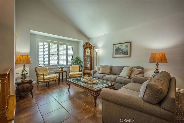 960 Via Serana, Upland, CA 91784 - living room featuring vaulted ceiling, dark tile patterned floors, and baseboards