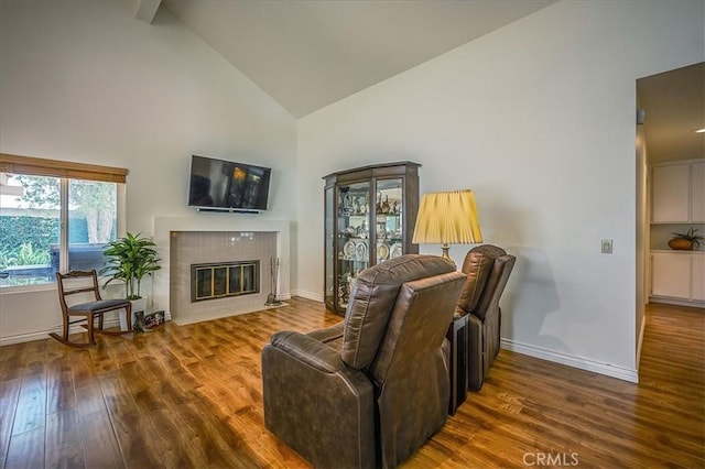 960 Via Serana, Upland, CA 91784 - living room with high vaulted ceiling, baseboards, wood finished floors, and a fireplace