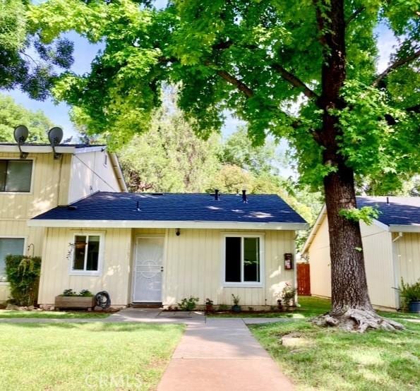 1367 Nord Ave, Chico, CA 95926 - view of front of house with a front lawn and roof with shingles