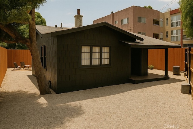 7148 Marshfield Way, Los Angeles, CA 90046 - back of property featuring a chimney and a patio