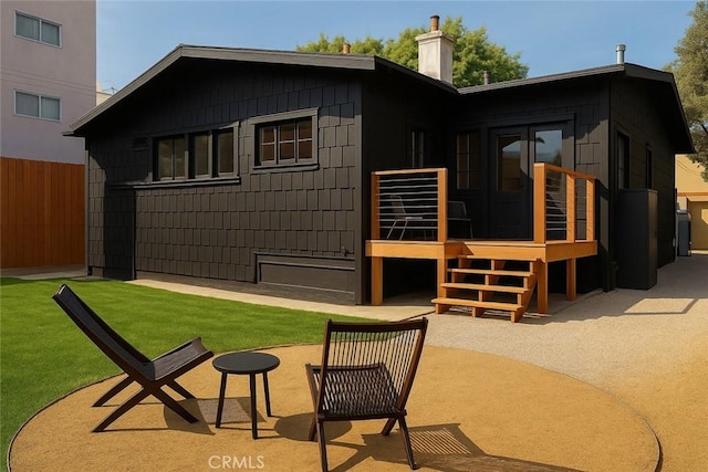 7148 Marshfield Way, Los Angeles, CA 90046 - back of property featuring a chimney and a deck