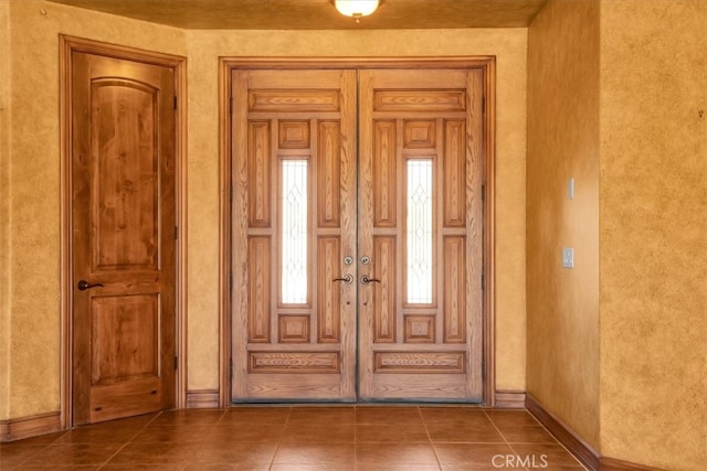 57934 Juarez Dr, Yucca Valley, CA 92284 - doorway to outside with tile patterned flooring and a textured wall