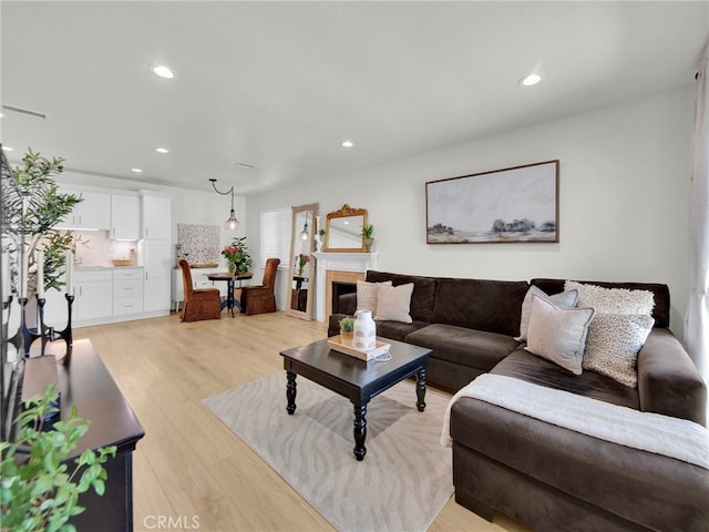 28839 Conejo View Dr, Agoura Hills, CA 91301 - living room featuring light wood-style floors and recessed lighting