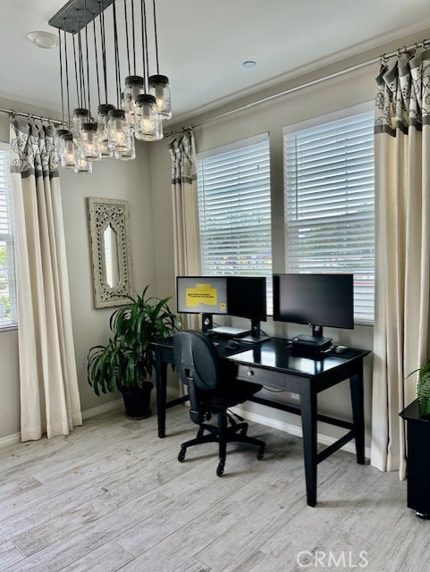 40265 Calle Real, Murrieta, CA 92563 - home office featuring healthy amount of natural light, a chandelier, wood finished floors, baseboards, and crown molding