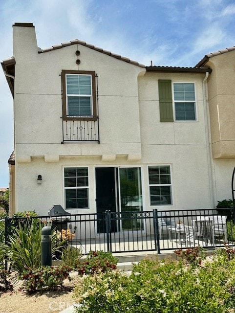 40265 Calle Real, Murrieta, CA 92563 - rear view of house featuring stucco siding and a chimney