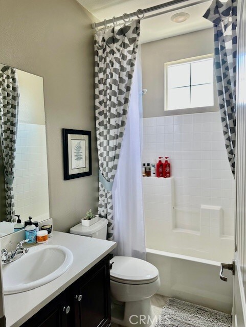 40265 Calle Real, Murrieta, CA 92563 - bathroom with vanity, toilet, and shower / tub combo