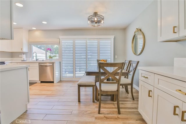 5427 E Pine Ridge Way Unit D, Anaheim, CA 92807 - dining space with light wood-type flooring, a chandelier, and recessed lighting