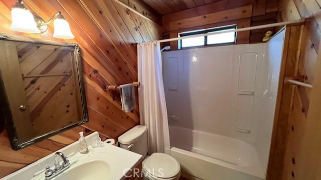 33796 Cedar Pines Ln, Green Valley Lake, CA 92341 - full bathroom featuring shower / bath combination with curtain, wooden walls, toilet, vanity, and wooden ceiling