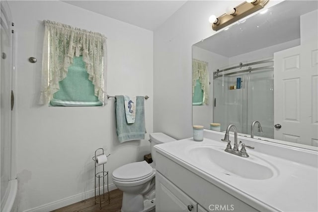 2722 Nandina Dr, Palmdale, CA 93550 - bathroom with a shower with shower door, vanity, and wood finished floors