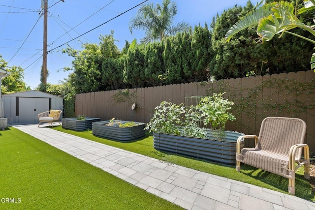 2156 Las Lunas St, Pasadena, CA 91107 - view of yard featuring a garden and a storage unit