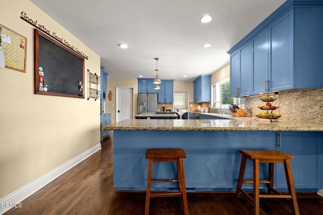 2156 Las Lunas St, Pasadena, CA 91107 - kitchen featuring blue cabinetry, stainless steel fridge, a peninsula, light stone countertops, and recessed lighting