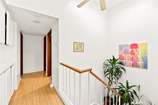 5715 Baltimore Dr Unit 35, La Mesa, CA 91942 - hall with an upstairs landing, light wood-type flooring, and baseboards