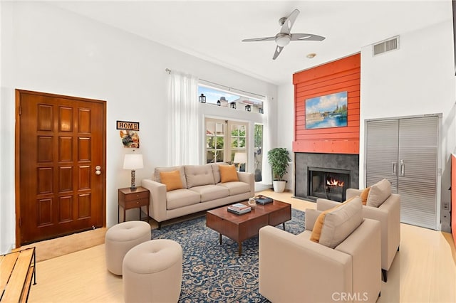 5715 Baltimore Dr Unit 35, La Mesa, CA 91942 - living room featuring a ceiling fan and a fireplace with flush hearth