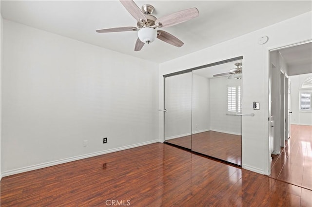 26966 Flo Ln Unit 318, Canyon Country, CA 91351 - unfurnished bedroom featuring wood finished floors, a closet, and ceiling fan