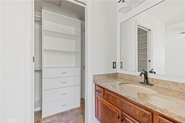 26966 Flo Ln Unit 318, Canyon Country, CA 91351 - bathroom featuring vanity and a spacious closet