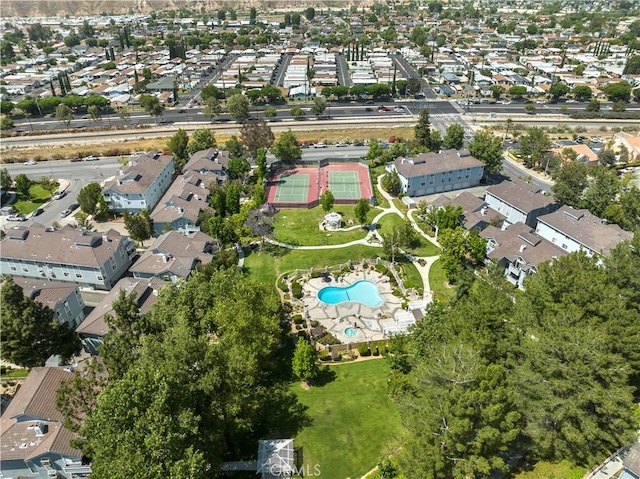 26966 Flo Ln Unit 318, Canyon Country, CA 91351 - aerial overview of property's location with a pool area and nearby suburban area