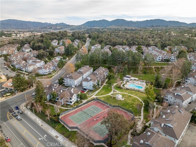26966 Flo Ln Unit 318, Canyon Country, CA 91351 - aerial view of property and surrounding area with nearby suburban area and a mountainous background