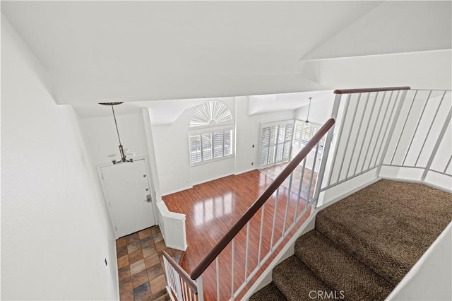 26966 Flo Ln Unit 318, Canyon Country, CA 91351 - stairway with a chandelier and stone finish floors