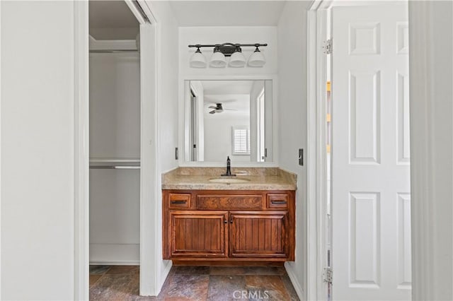 26966 Flo Ln Unit 318, Canyon Country, CA 91351 - bathroom featuring vanity, ceiling fan, and stone finish floors