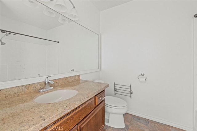 26966 Flo Ln Unit 318, Canyon Country, CA 91351 - bathroom featuring vanity, a shower, and stone finish flooring