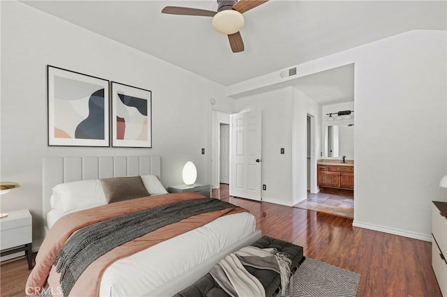 26966 Flo Ln Unit 318, Canyon Country, CA 91351 - bedroom featuring wood finished floors, connected bathroom, and ceiling fan