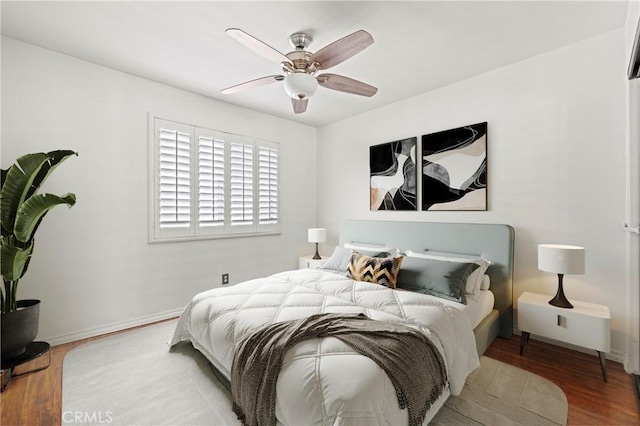 26966 Flo Ln Unit 318, Canyon Country, CA 91351 - bedroom featuring wood finished floors and ceiling fan